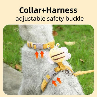 Cat wearing cartoon bee-themed adjustable harness and collar set for outdoor walking.